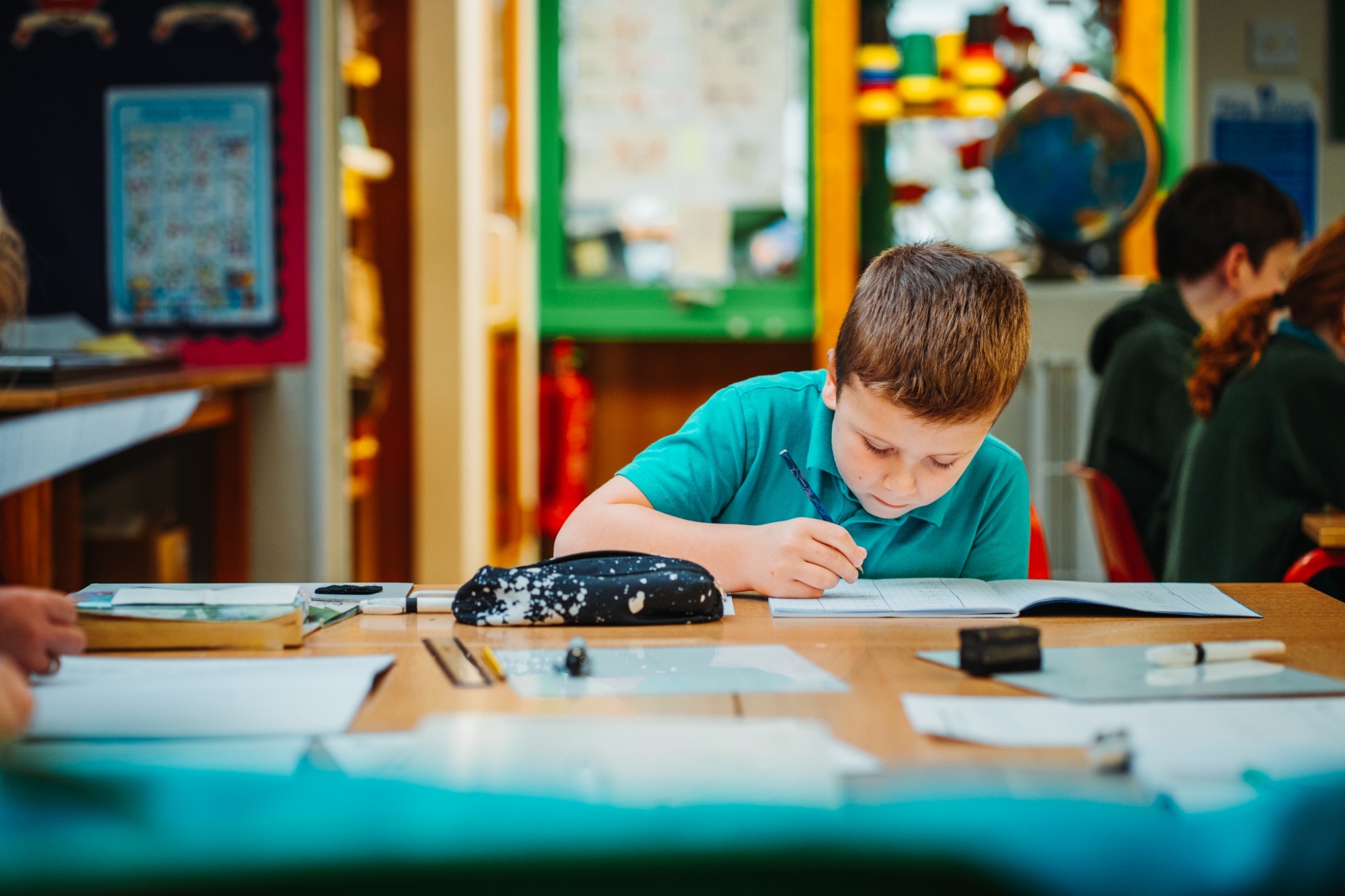boy working at classroom table